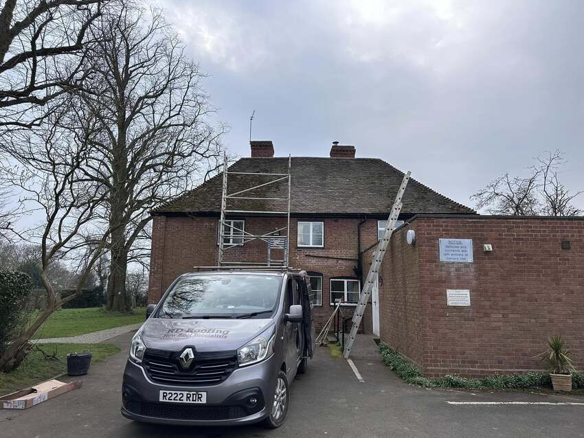 RD Roofing van and scaffold set up for a re-roof